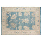 Deep blue 10x14 Oushak area rug with cream and taupe floral palmettes and a broad cream border.