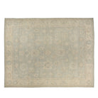 Soft light blue 12x15 Oushak area rug with beige floral medallions and subtle blush accents.