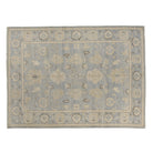 Periwinkle blue 9x12 Oushak area rug with ivory floral star medallions and delicate charcoal geometric accents.