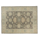 Deep earthy brown 10x14 Oushak area rug with taupe palmettes and a seamist green border.