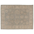Hand-knotted 9x12 Oushak area rug with a muted celadon green field, soft ivory palmettes, and a beige border.