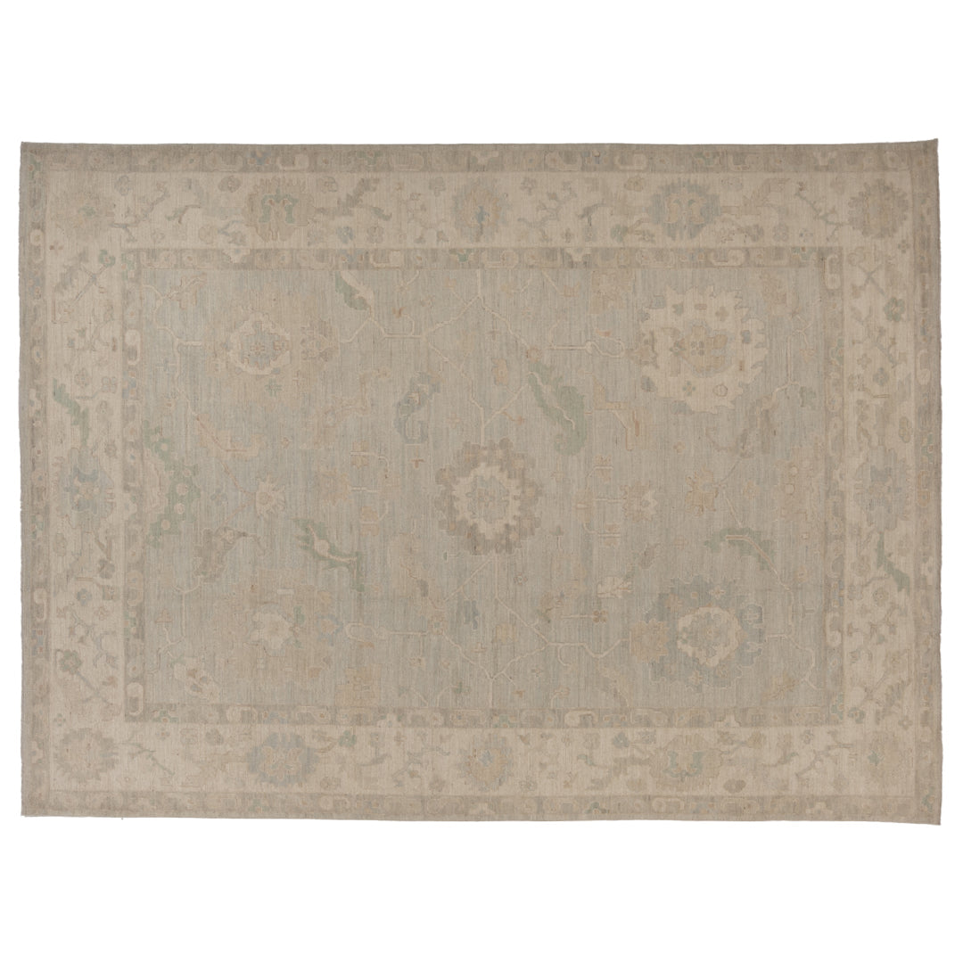 Hand-knotted 10x14 Oushak area rug with a faded light blue center field, ivory border, and soft sage green details.