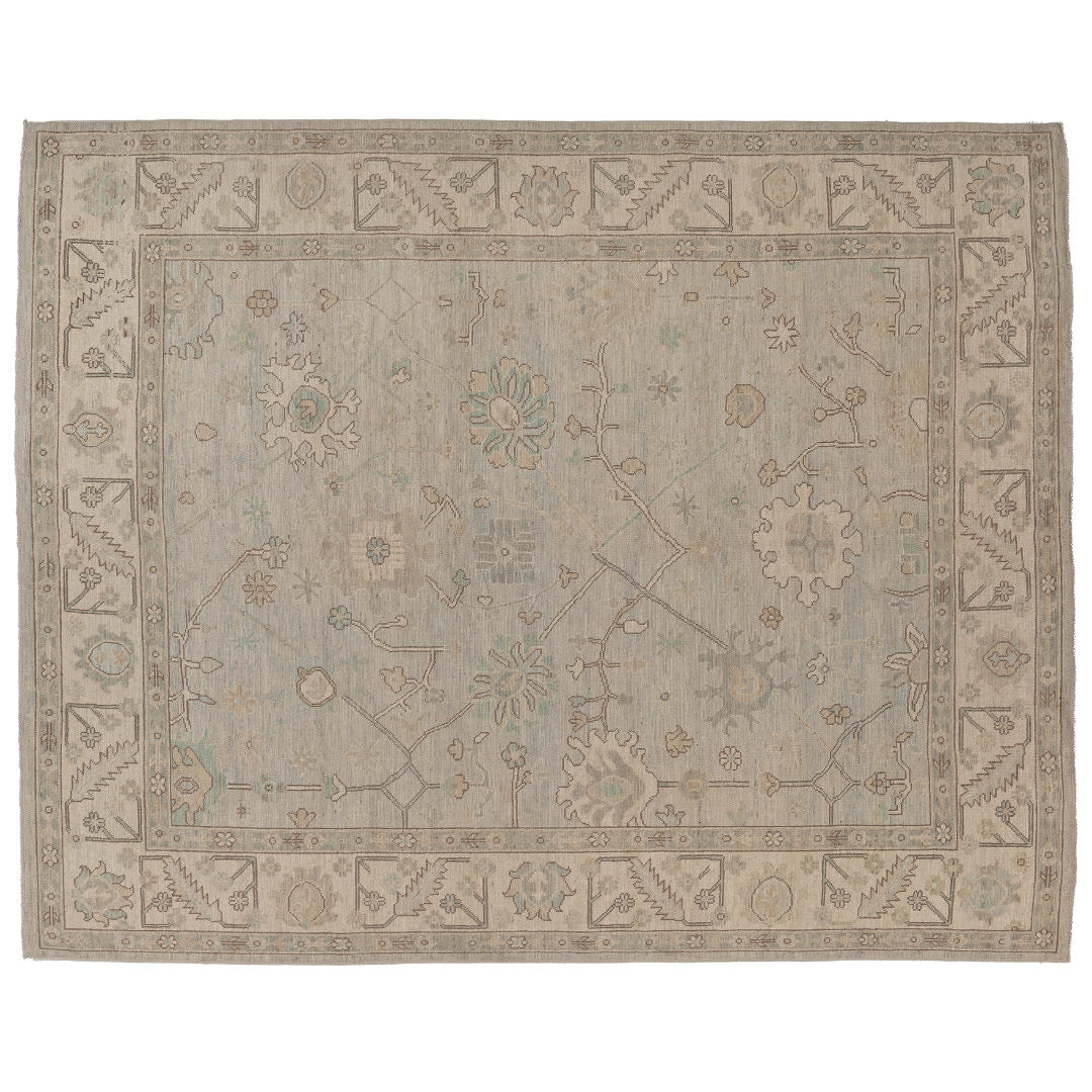 Hand-knotted 8x10 Oushak area rug with a muted light blue field, soft ivory medallions, and a sandy beige border.