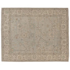 Hand-knotted 8x10 Oushak area rug with a muted light blue field, soft ivory medallions, and a sandy beige border.