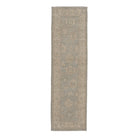 Soft ice blue traditional Oushak runner rug with a muted ivory and beige floral border and distressed low pile finish.