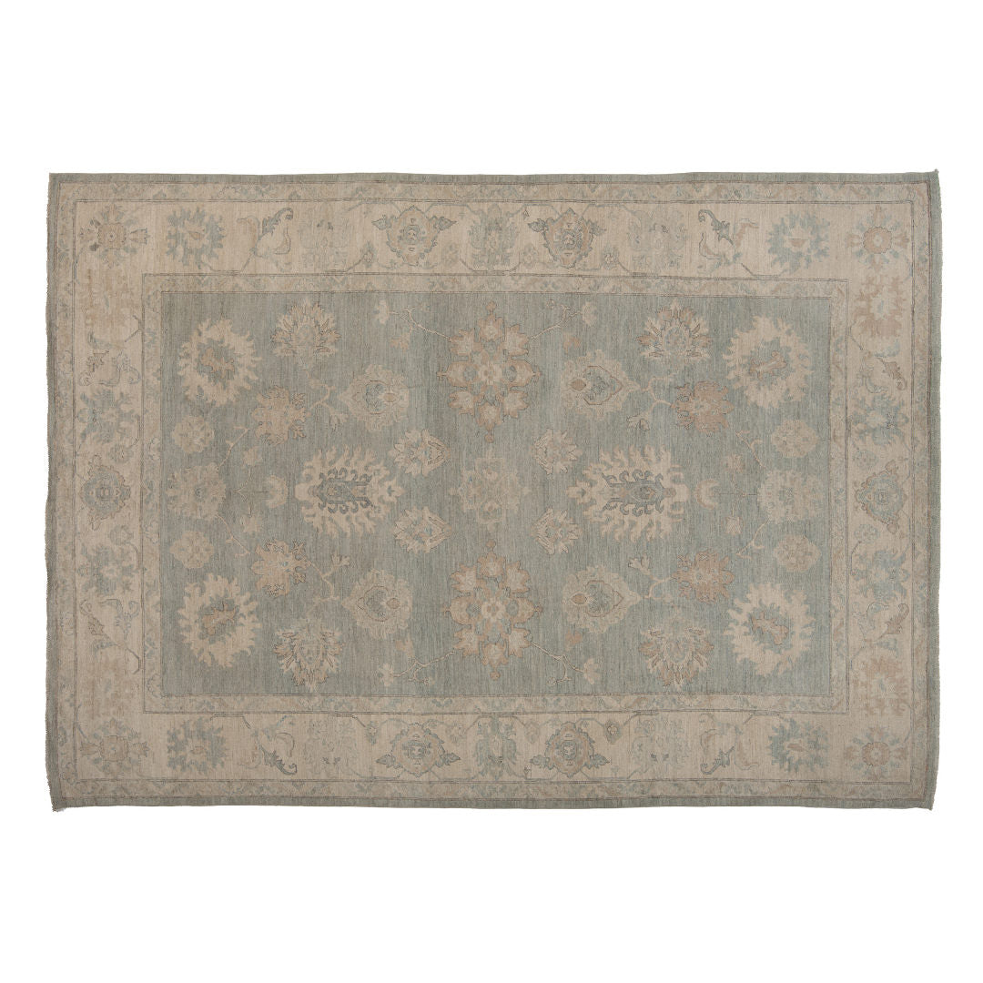 Soft green 10x14 Oushak area rug with ivory floral palmettes and a wide beige border.