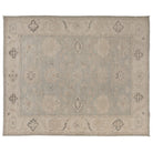 Hand-knotted 9x12 Oushak area rug with a muted grey-blue field, soft ivory details, and a wide ivory-beige border.