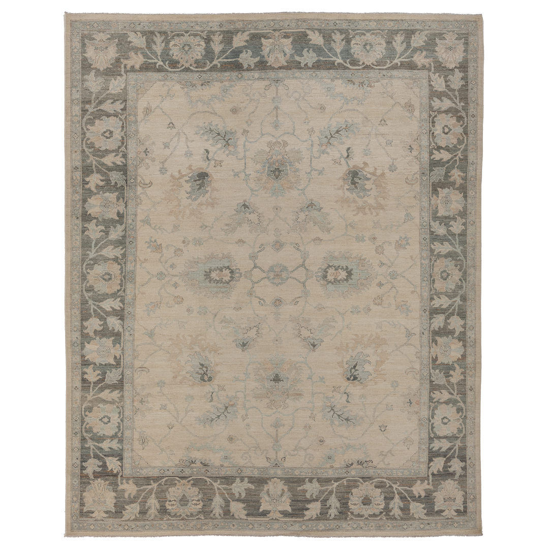 Hand-knotted 9x12 Oushak area rug with a light ivory center field, bold deep brown border, and soft blue accents.