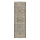 Soft light blue traditional Oushak runner rug with a muted ivory and beige geometric border and distressed low pile finish.