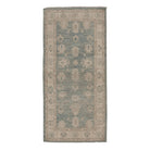 Sage green 2.5x8 Oushak runner rug with camel star cartouches and a warm beige floral border.