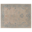 Hand-knotted 9x12 Oushak area rug with an ivory center field, cornflower blue border, and terracotta orange details.