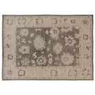 Hand-knotted 10x14 Oushak area rug with a deep brown center field, cream-beige border, and light blue accents.