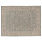 Hand-knotted 9x12 Oushak area rug with a muted aqua field, soft ivory palmettes, and a cream-beige border.