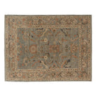 Slate blue 9x12 Sultanabad area rug with large rust-brown floral palmettes and a camel border.