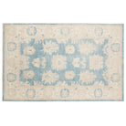 Ultra-faded cream 6x9 Oushak area rug with taupe floral motifs and soft slate blue accents.