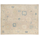 Ultra-faded cream and taupe 9x12 Oushak area rug with aqua blue star medallions and accent motifs.