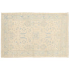 Ultra-faded cream 4x6 Oushak area rug with taupe floral motifs and a soft aqua blue border.