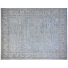 Soft aqua blue 12x15 Oushak area rug with gray floral motifs and a broad light gray border.