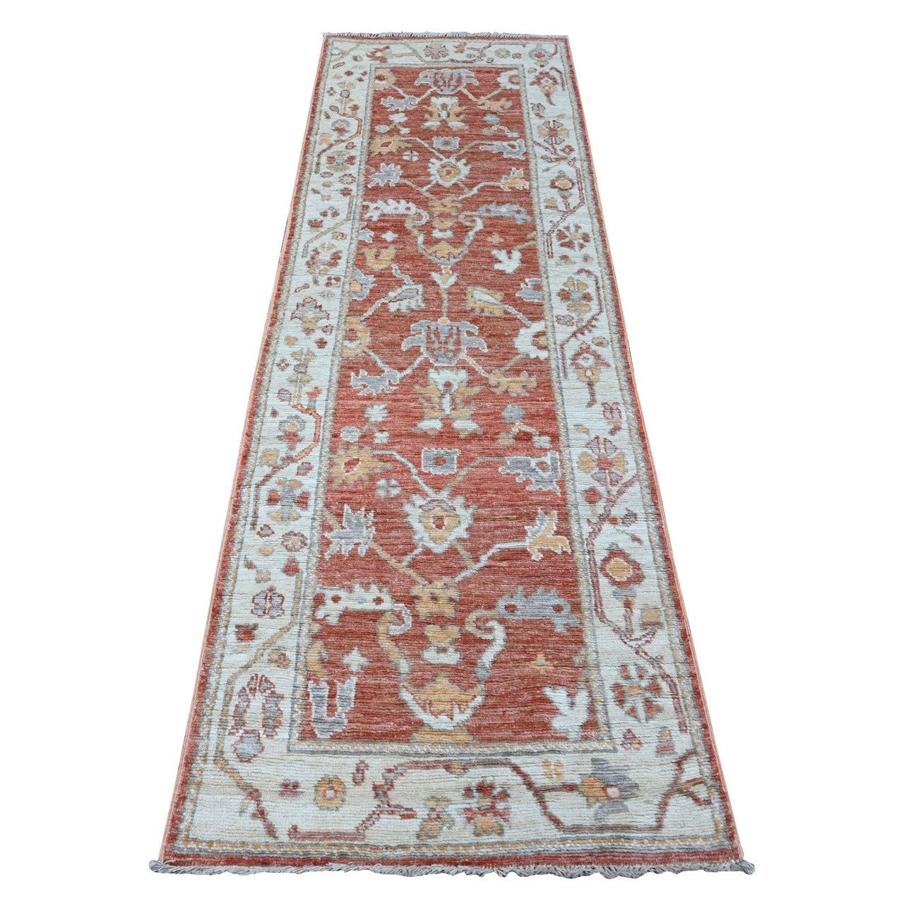 Warm coral 3x8 Oushak runner rug with cream floral lattice, tangerine accents, and a wide cream border.