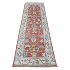 Warm coral 3x8 Oushak runner rug with cream floral lattice, tangerine accents, and a wide cream border.